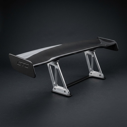 A carbon fibre GT wing on a dark background